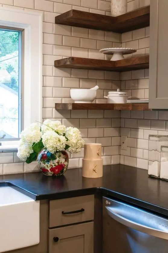 thick wooden corner shelves in a farmhouse kitchen add texture and interest to the space