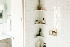 tiny corner shelves will literally save your life in a tiny shower space accommodating everything you need