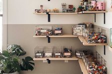 wall-mounted corner shelves with toys and containers for Lego are an optimal idea for a kids’ playroom