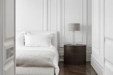white paneling makes the bedroom super refined and chic at once, just add some furniture to this backdrop