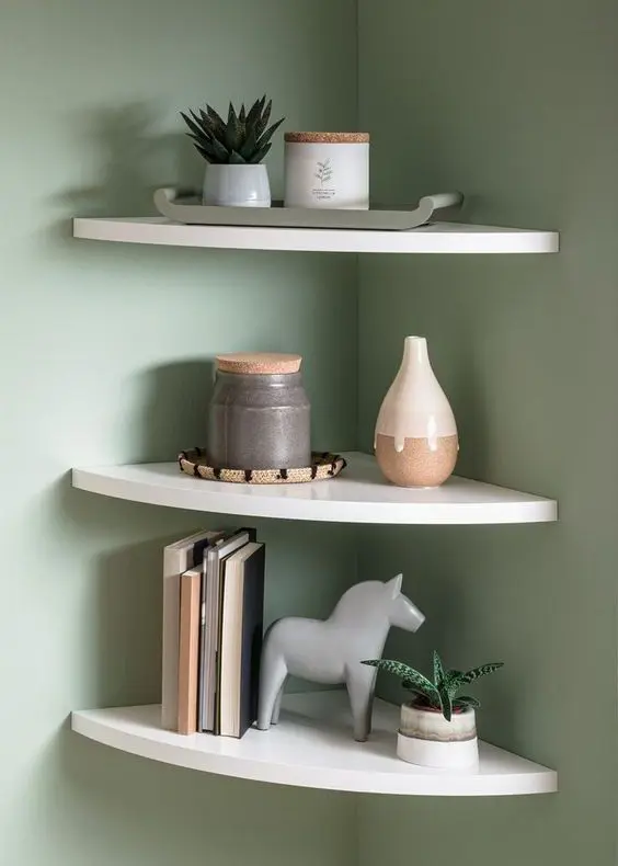 white rounded corner shelves with books, vases and potted plants are a cool solution for a Scandinavian space