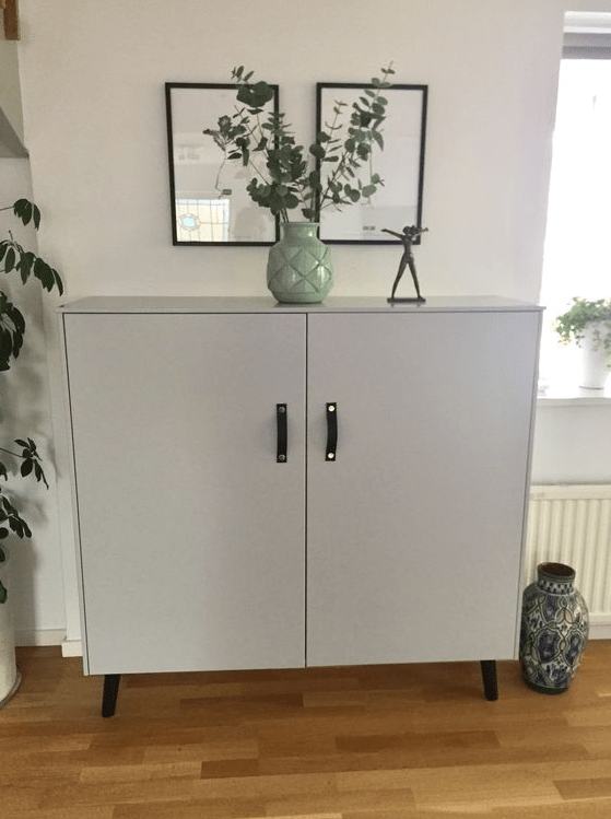 a Metod hack with grey paint, legs and leather handles gives you a Scandinanavian furniture piece