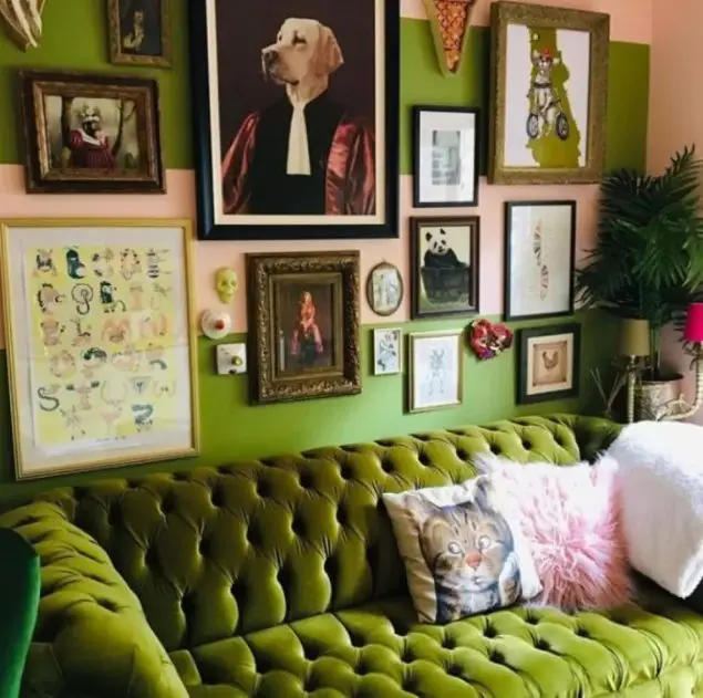 a bold maximalist living room with green walls and furniture, a gallery wall with bright artworks and potted plants