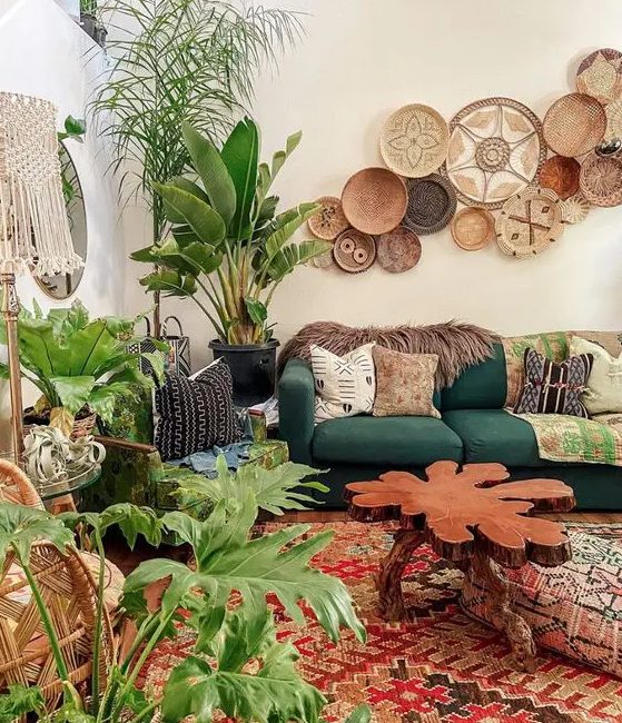 a bright boho living room with decorative baskets, pretty furniture and lots of potted plants to feel fresh