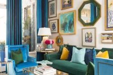 a colorful maximalist living room with double height ceilings, a neutral floor with a printed rug, blue and green furniture, a bold gallery wall
