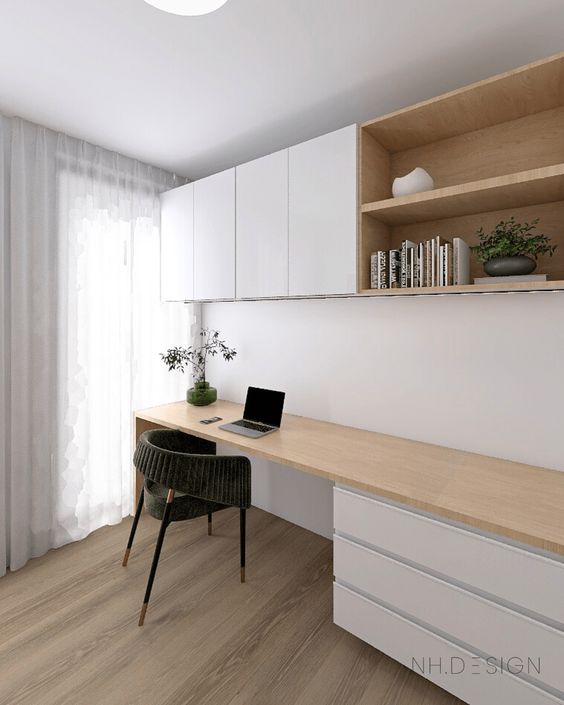 a contemporary home office nook with IKEA Metod cabinets and a large desk with drawers, a comfy chair and some decor