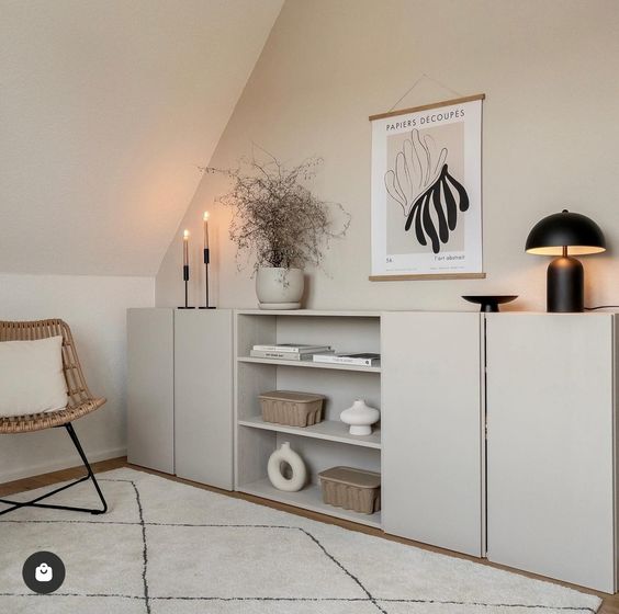 a dove grey sideboard made of IKEA Metod units, with shelves, candles, lamps and chic decor