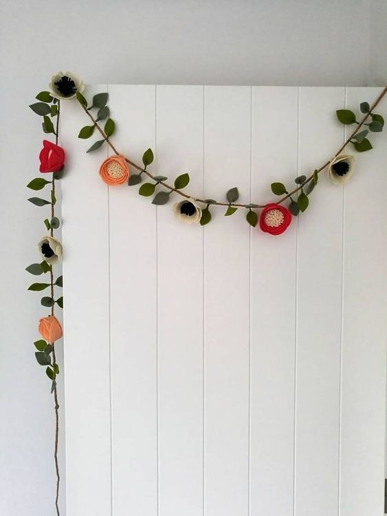 a floral garland made of faux blooms is a cool idea for both spring and summer, you can DIY it