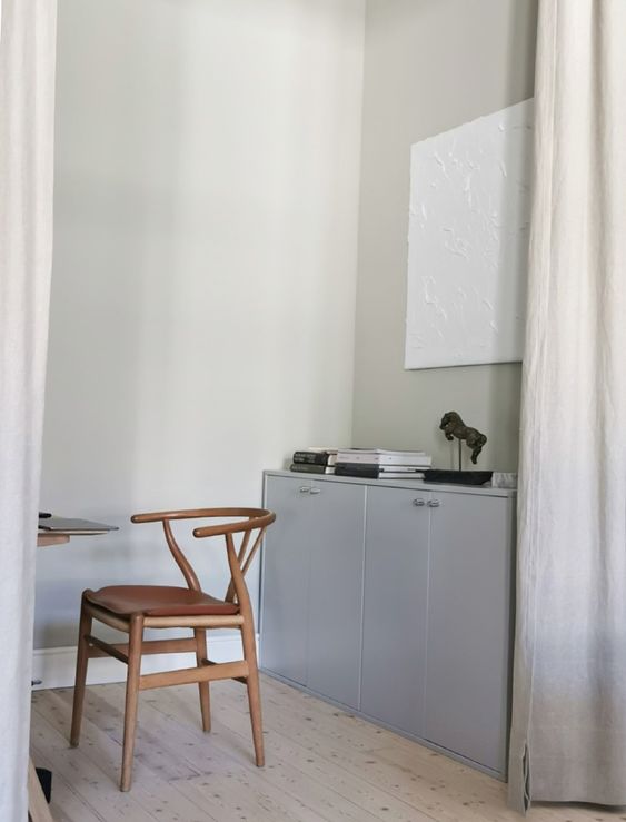a light grey crendenza of two IKEA cabinets, wtih decor and books is a stylish idea for a Scandinavian space