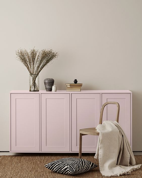 a light pink IKEA Metod sideboard with shaker doors, with stylish decor for a Scandinavian space