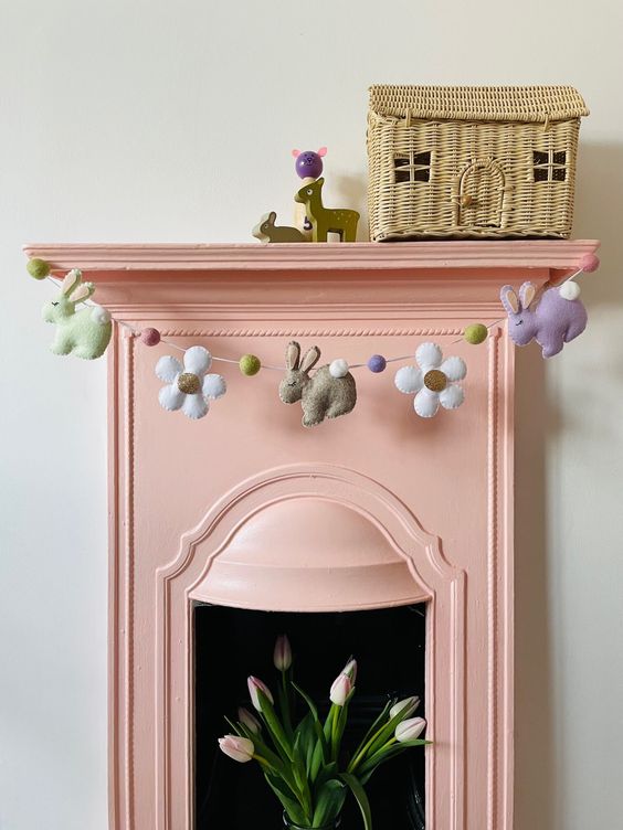a lovely pastel felt bunny garland with flowers and pompoms is a cool decoration for spring and Easter