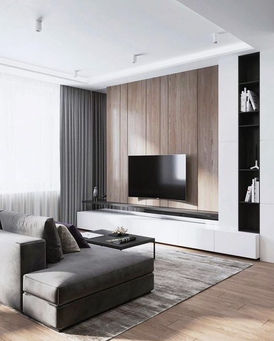 a minimalist living room with a wooden wall, grey curtains, a sofa and a rug plus touches of black here and there