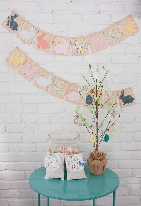 a pastel garland of upcycled cards, pastel paper bunnies is a cool decoration you can make yourself
