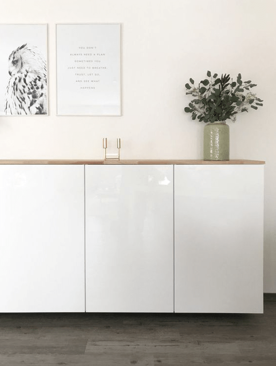 a stylish floating sideboard made of IKEA Metod cabinets and a light-colored wooden tabletop