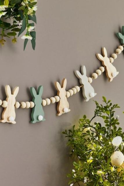 an Easter garland of wooden bunnies and beads is a cool decoration for spring and Easter