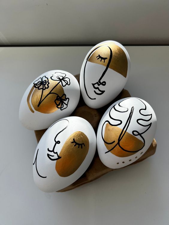 beautifully painted Easter eggs done with a black sharpie and some gold paint are amazing for Easter