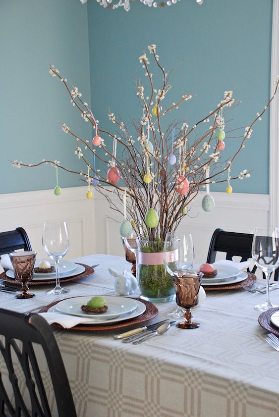 blooming branches with pastel eggs hanging are amazing to style your space for Easter and spring
