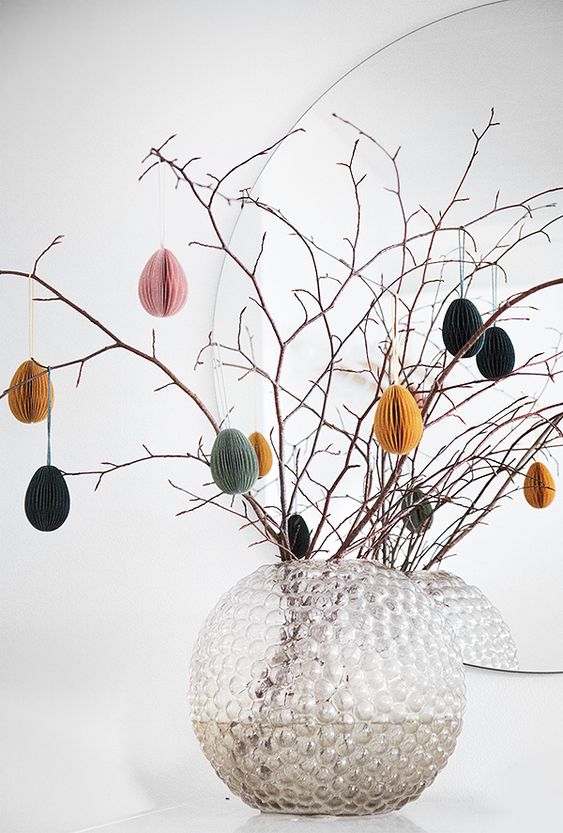 branches with colorful paper eggs placed in a vase are a cool Easter tree that you can easily make