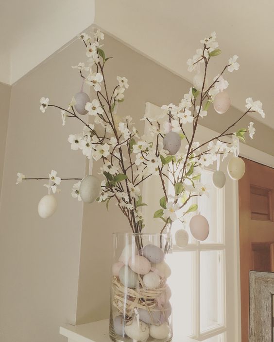 faux blooming branches with pastel fake eggs and the same eggs placed in a vase are amazing for spring or Easter