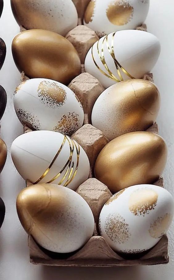 gold and white Easter eggs with ombre touches, polka dots and gold yarn are amazing for a glam party