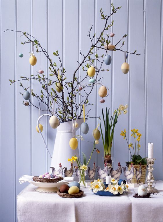 greenery branches with pastel colored fake eggs are a gorgeous spring or Easter centerpiece