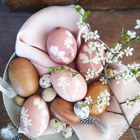 pretty pastel pink eggs with painted cherry blossoms can be made with simple spray painting