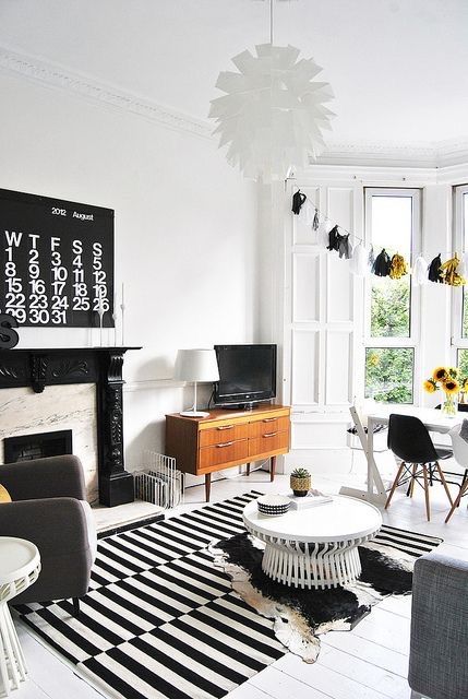 a b&w living room with a fireplace