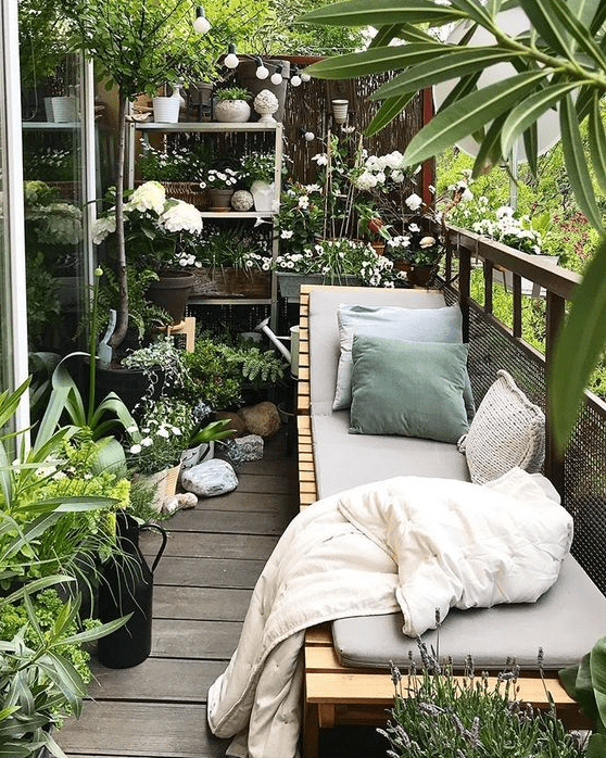 a cozy small balcony with a garden