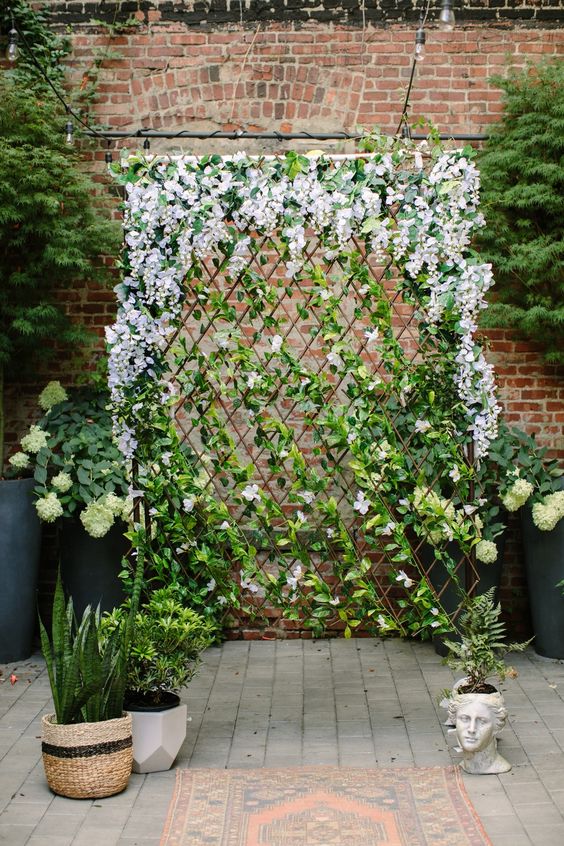 a beautiful trellis covered with greenery and blooms will instantly make your outdoor space more sophiticated and chic
