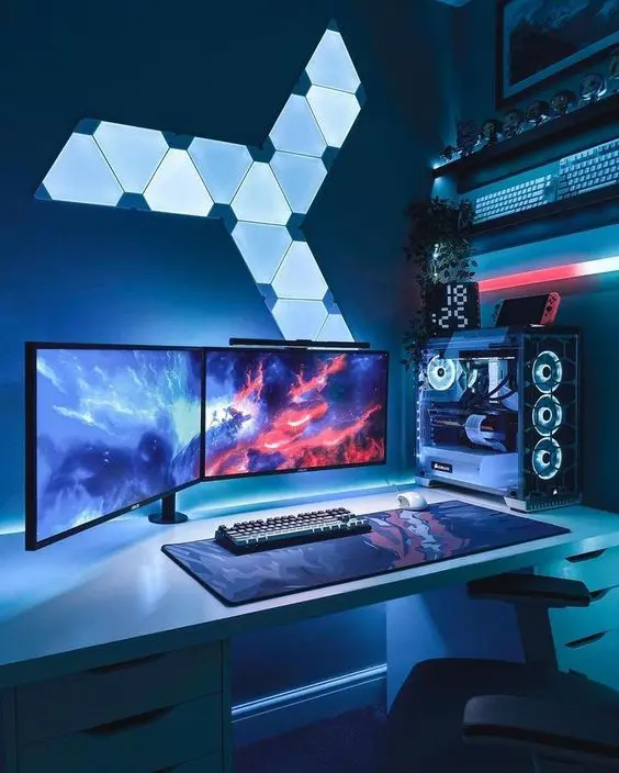 a bold and laconic gaming nook with lights, screens, keyboards and some decor on the shelf above plus a chair
