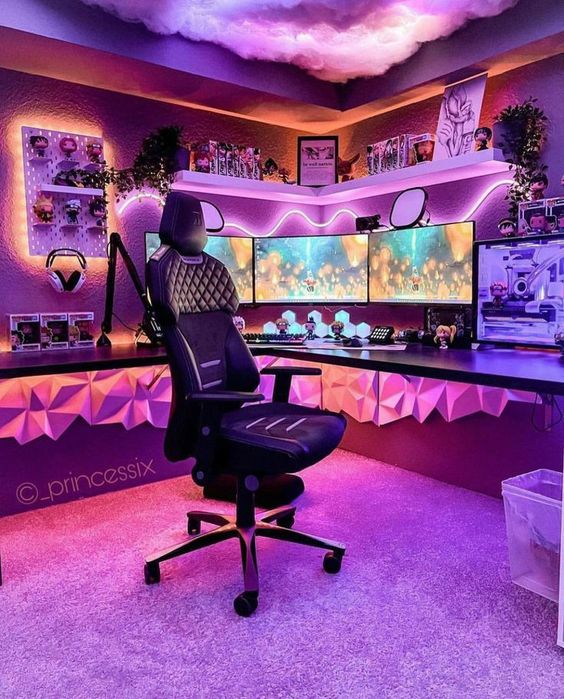 a bold purple and pink gaming desk setup with a corner desk, a black chair, neon lights, three screens, cloud lights on the ceiling