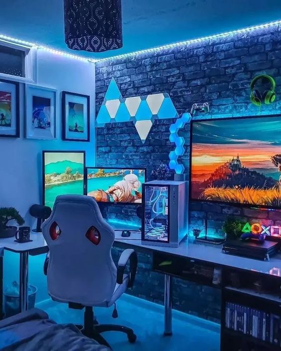 a bright gaming nook with a PC, a large screen, some fun and blue neon lights, a chair and artwork on the wall
