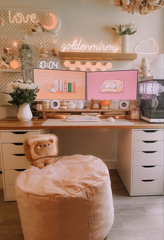 a cute gaming desk setup with a desk, a pink pouf, some toys, shelves, a neon light, a memo board with decor is wow