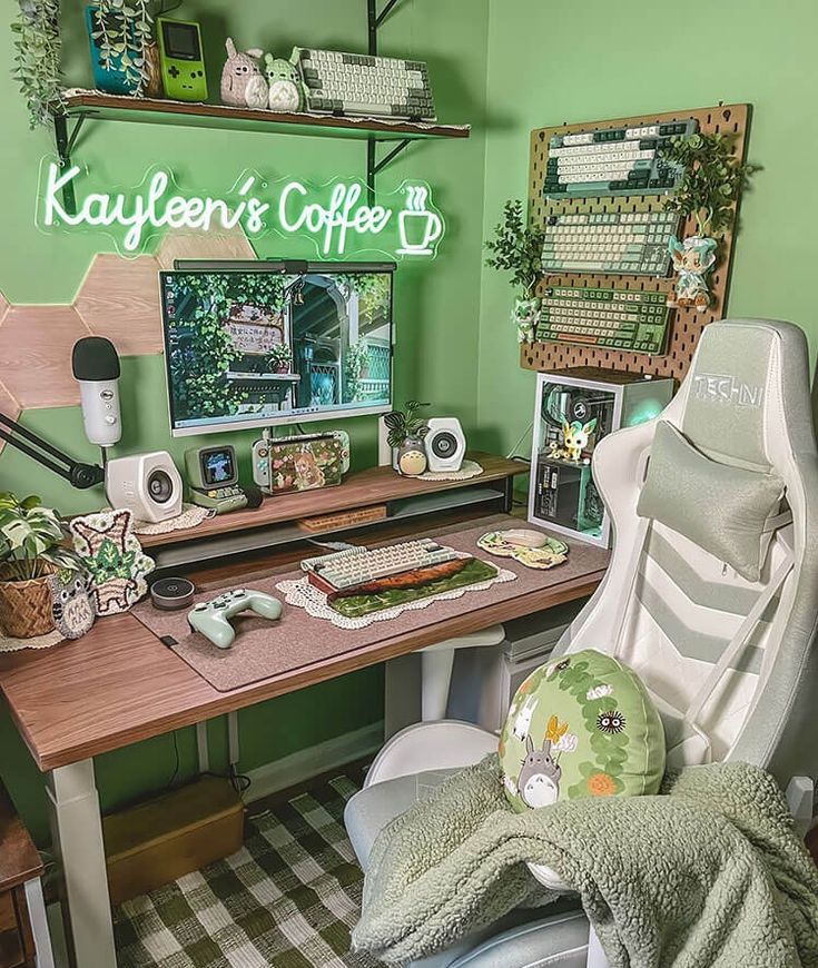 a green farmhouse gaming desk setup with a green chair, a desk with a stained, a board with keyboards, potted plants and cute decor