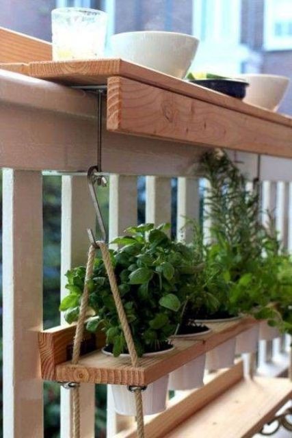 a hanging wooden shelf with planters with greenery is a smart solution that will work even for a very small space