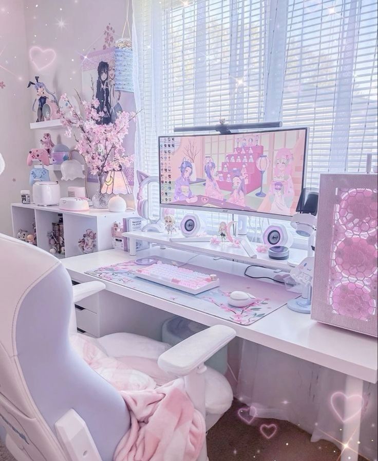 a light pink and white gaming desk setup with a desk, a stand with a monitor, a white chair, a perfect PC and some kawai decor