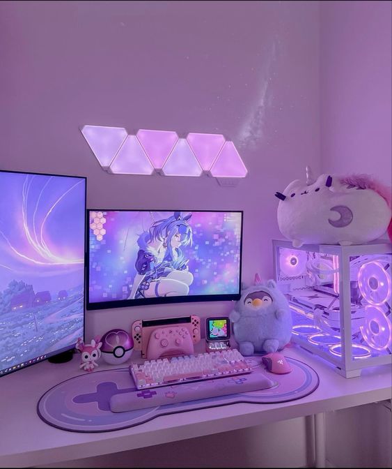 a small and lovely gaming desk setup with a cool PC, a lovely keyboard, some toys and decor is a super cool idea