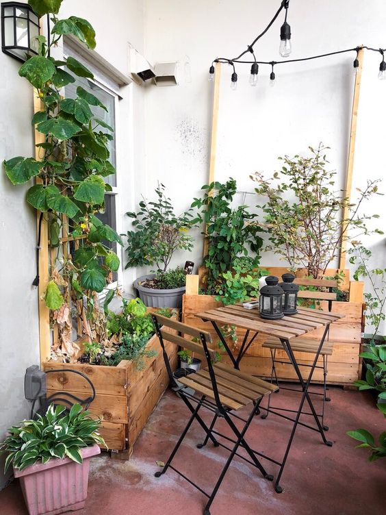 a small balcony with stained box planters with herbs and veggies is a cool space with a rustic feel, and you can grown anything here