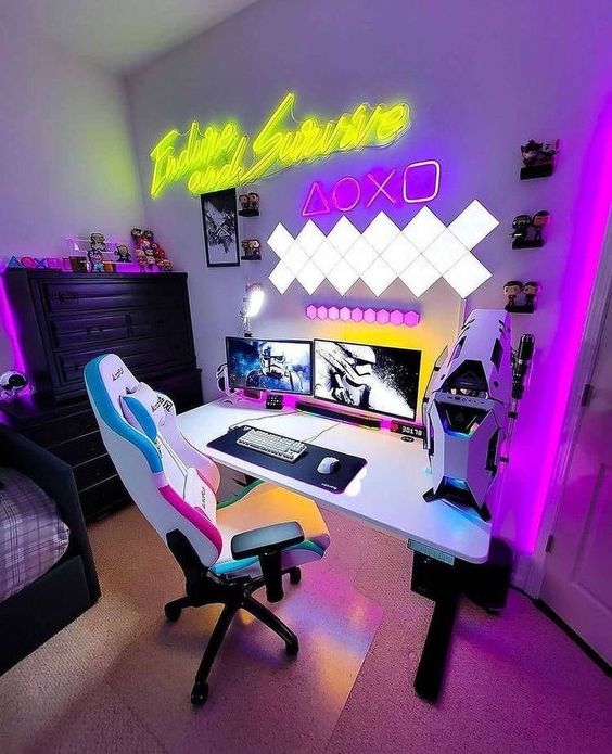 an extra bold neon gaming desk setup with yellow,, white and pink lights, a white chair with colorful details and some devices