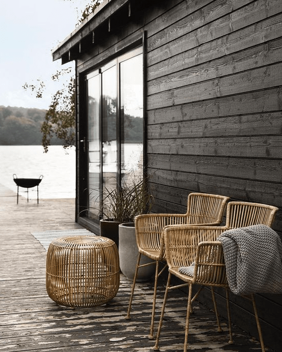 tall rattan chairs and a matching side table can be used both indoors and outdoors