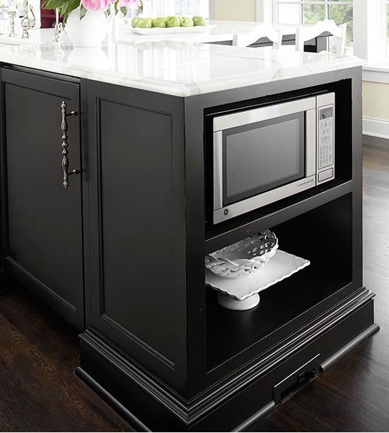 kitchen island with a microwave in