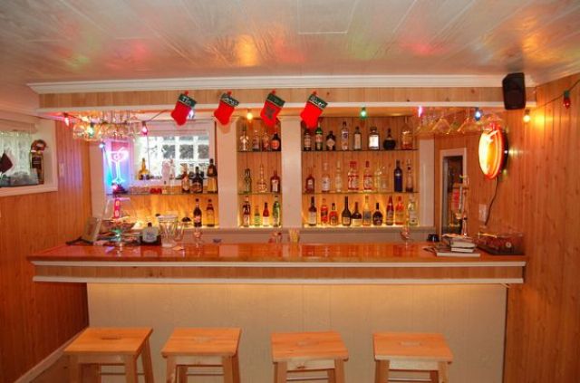 light-colored wood basement bar