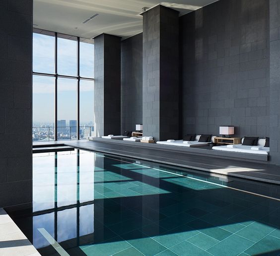 minimalist pool pavillion with stunning big city views