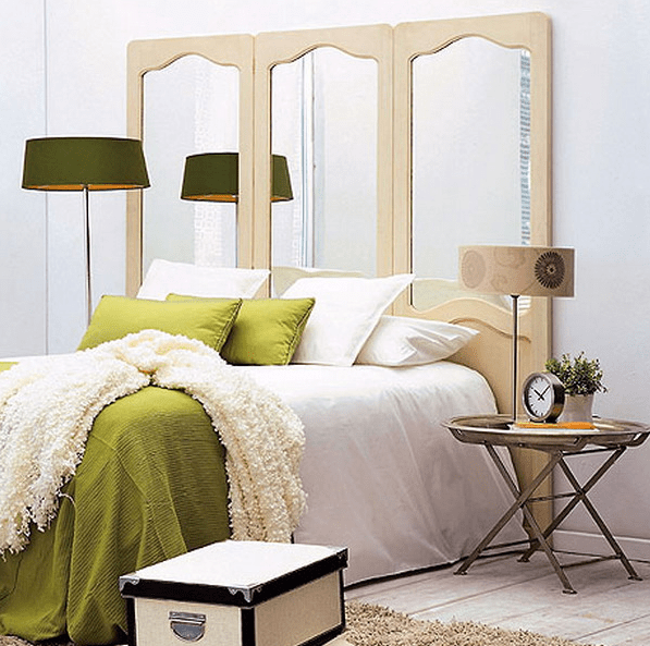 using mirrors as headboards is a great way to add mirrors to your bedroom's interior