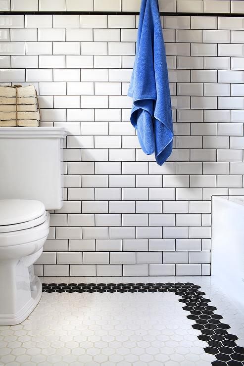 22 black mosaic border tiles on the bathroom floor