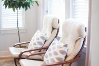 22 white Poang chair with printed cushions and fur covers