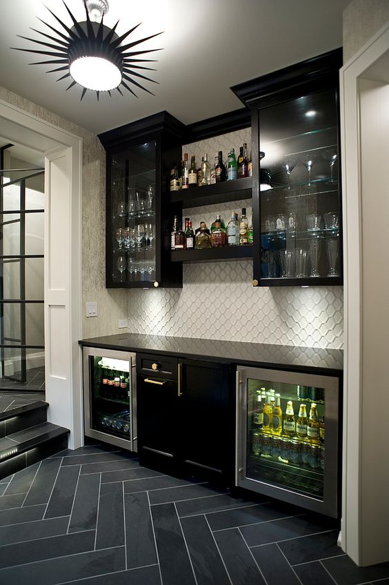 basement bar with dark clear view cabinets