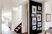24 black accent wall with pictures