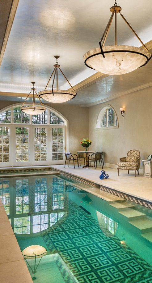 indoor pool with a tiled pattern on the bottom