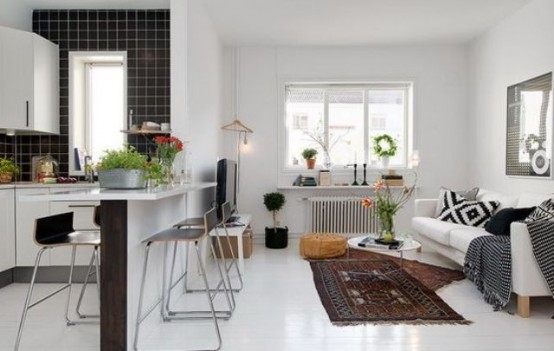 Part of a wall that separate a living area with a kitchen could become an additional dining area.